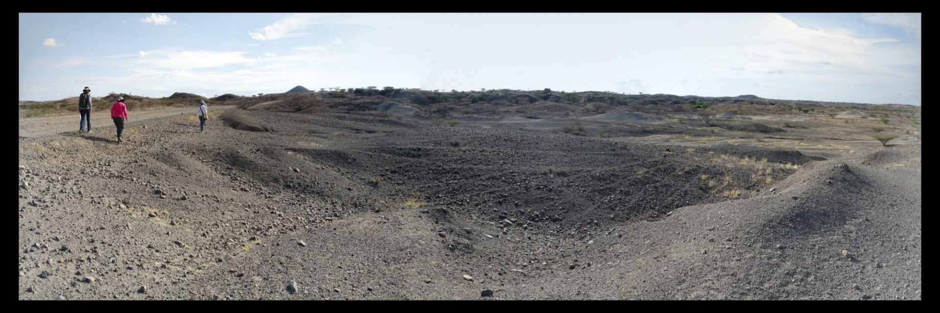 Geologists walking across an expanse